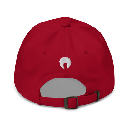 Red dad hat with small white embroidered afro on back.