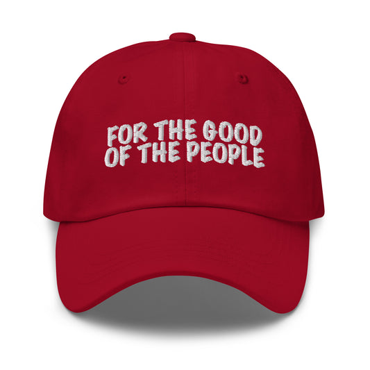 For the good of the people embroidered on front of red dad hat.