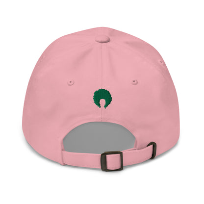 Pink dad hat with small green embroidered afro on back.